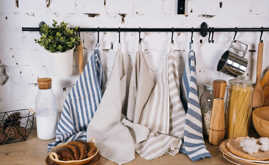 Kitchen textiles and wooden utensils hanging display