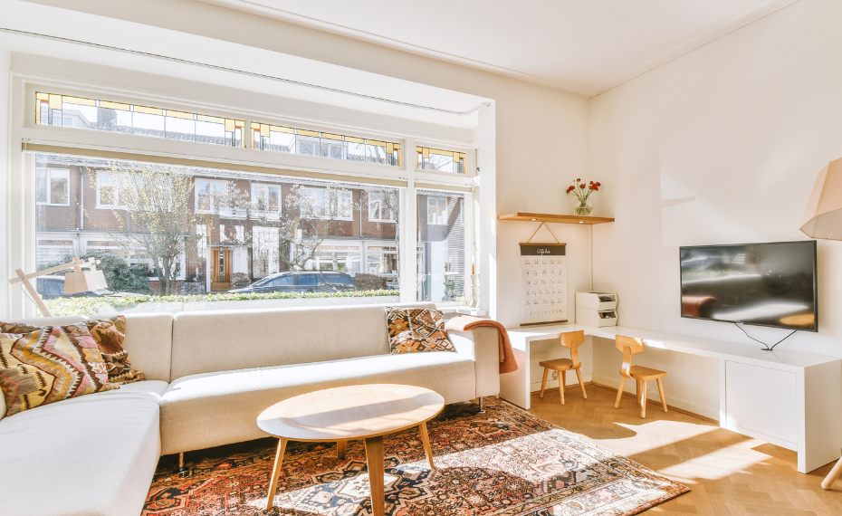 Modern living room with area rugs and wooden furniture