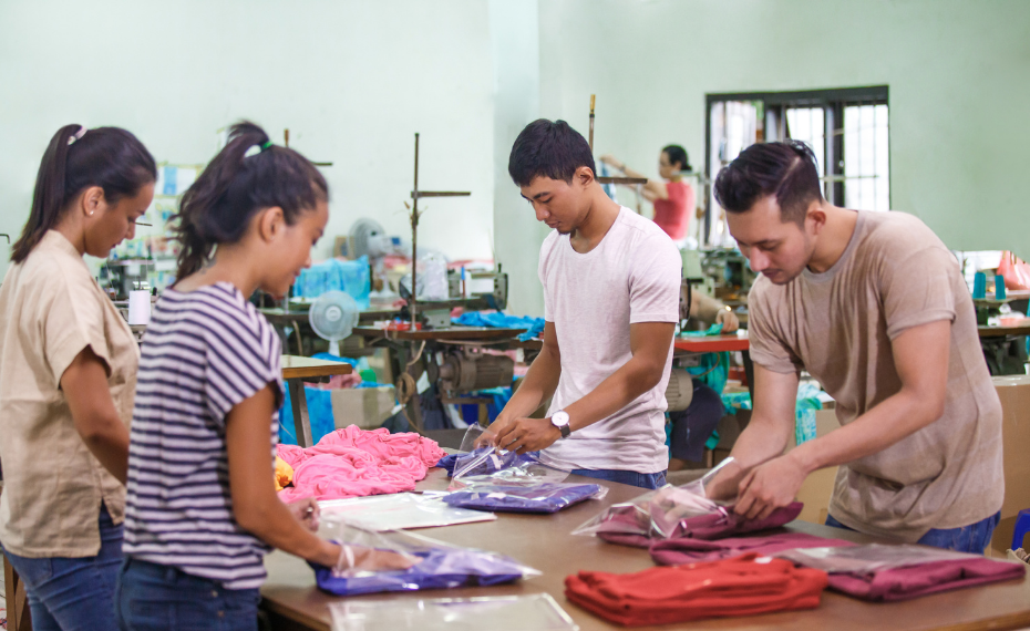 Workers in textile factory managing production